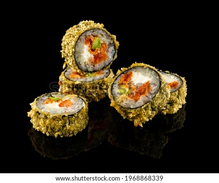 Salmon fry roll. Set sushi roll. Traditional Japanese cuisine. Isolated on black background.