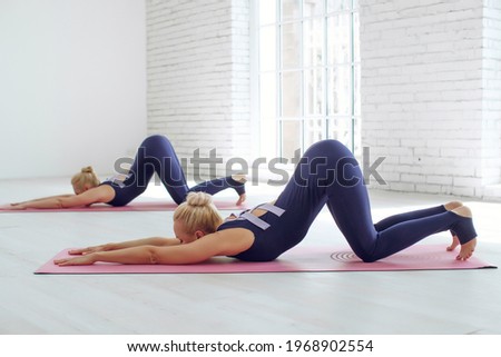 Yoga woman. A group of two goes in for sports. High quality photo.