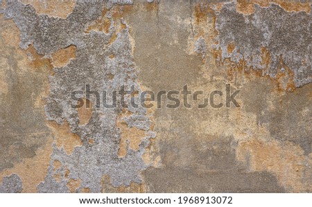 Old and aged stone and cement yellow wall texture