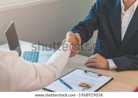 Close up hand of home, apartment agent or realtor handshake with newlandlord, tenant or rental. After the banker has approved and signed the purchase contract agreement successfully. Property concept.