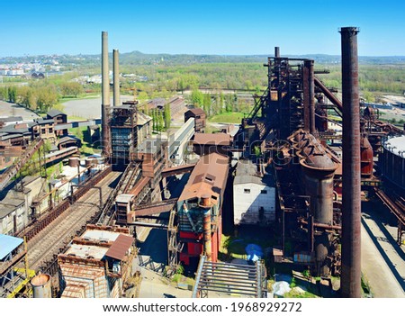 Aerial view of the old rusty abandoned ironworks factory area. Old ironworks factory with chimneys.
