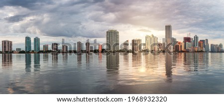 Miami, Florida, USA downtown skyline from across the Biscayne Bay at twilight.