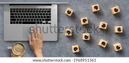 Dice with Cookie icons and a laptop conceptual of the GDPR regulations introduced by the EU governing data collection and privacy of information for individuals online.