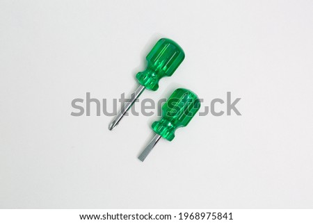 Two green screw driver stock photo isolated on white background. Top view.
