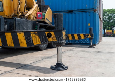 Outrigger mobile crane for heavy duty construction side. Hydraulic supports for the crane legs. Royalty-Free Stock Photo #1968995683