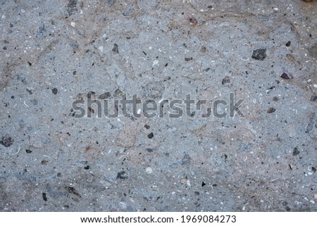 Concrete structure with natural stone gravel. Creative vintage background