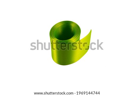 green satin ribbon on white background with place for text