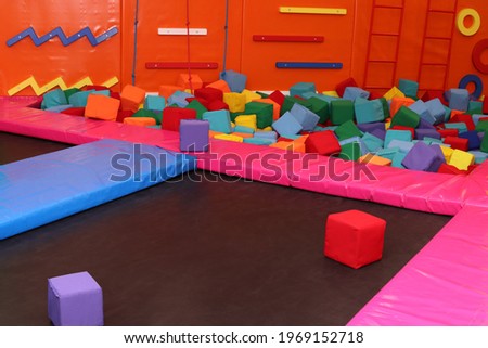 Trampoline, climbing wall at children's playroom, entertainment center Royalty-Free Stock Photo #1969152718