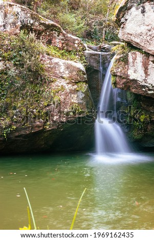 long exposure picture of a waterfall in the wood in jijel algeria , hiking in the woods with river flowing, north african wilderness