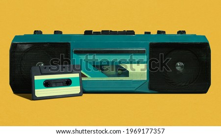 Retro blue portable radio recorder with cassette from 80s isolated on yellow background, pop art design, close up