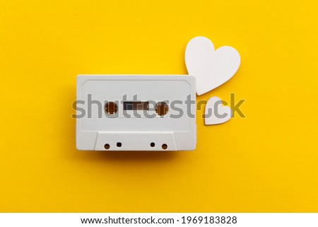 retro audio cassette tape surrounded by white love hearts
