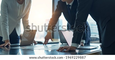 Group of asian businessperson meeting in the office. Group discussion. Management strategy. Brainstorming. Royalty-Free Stock Photo #1969229887