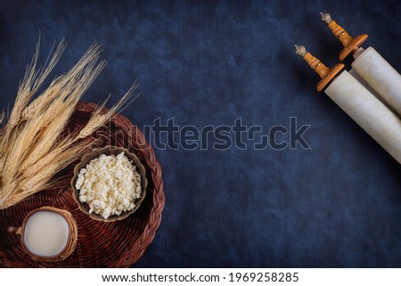 Shavuot is a traditional religious Jewish celebration holiday on torah scroll Royalty-Free Stock Photo #1969258285