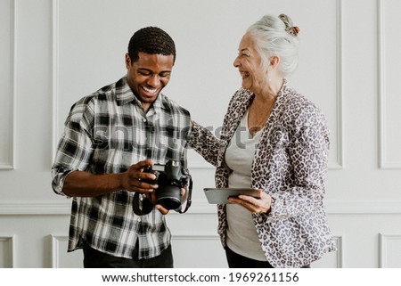 Male photographer and senior female client