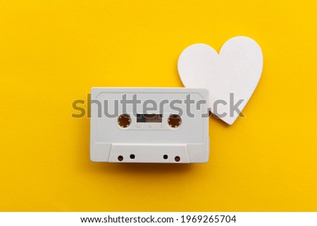 retro audio cassette tape surrounded by white love hearts