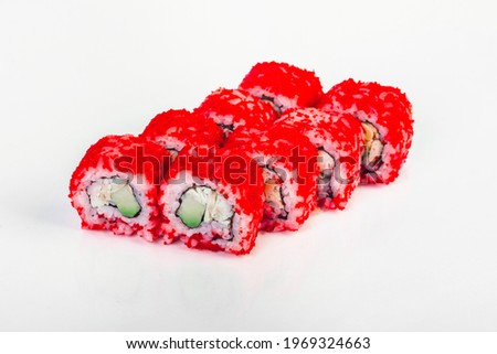 Sushi roll with avocado and shrimp in red caviar on white background isolated