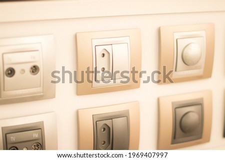 Store socket and switch display of productrs on sale on wall demonstration models for customers