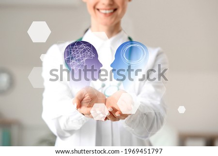 Female psychologist using virtual screen in clinic Royalty-Free Stock Photo #1969451797