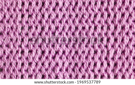 Close up picture of pink fabric fibers, selective focus.