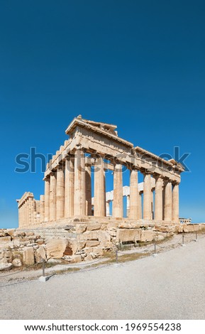 Parthenon temple on a bright day with blue sky. Panoramic image taken in Acropolis hill in Athens, Greece. Classical ancient Greek civilization landmark, famous place, vertical panoramic travel