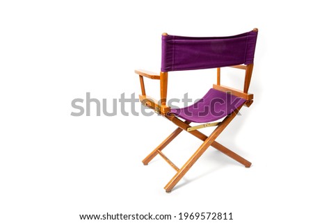 looking at the back of a purple folding director's chair isolated on white Royalty-Free Stock Photo #1969572811