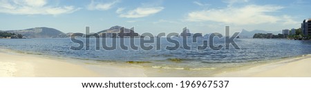 Scenic beach panorama view of Sugarloaf Mountain and mountain geography from across Guanabara Bay in Niteroi Rio de Janeiro Brazil