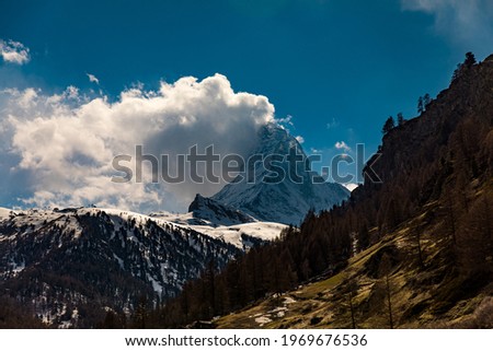 The famous Matterhorn with cloud flag