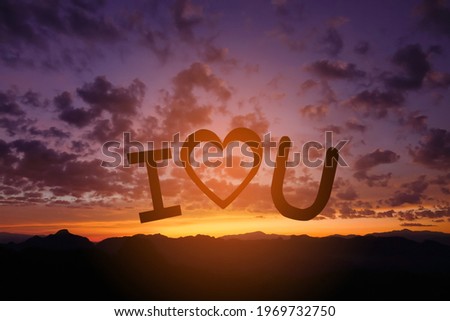 Silhouette paper cut I love you on the background sunset.                    