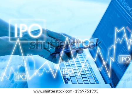 Businessman hand touching IPO or Initial Public Offering sign on virtual screen.