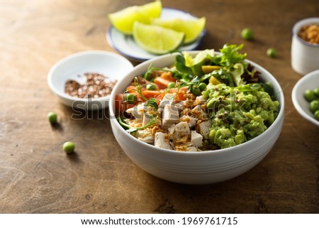 Healthy chicken bowl with avocado mash