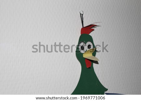 green cockerel on white background
