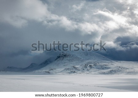 Snowshoeing Kungsleden trail from Abisko to Nikkaluokta in early April, Lapland, Sweden  Royalty-Free Stock Photo #1969800727