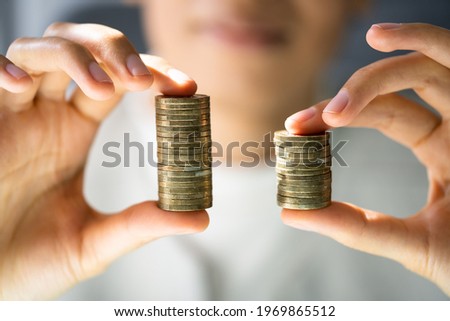 Compare Wage Gap, Money Pay And Pay Royalty-Free Stock Photo #1969865512