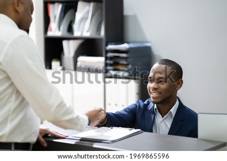 African Client At Hotel Reception Cashier Counter