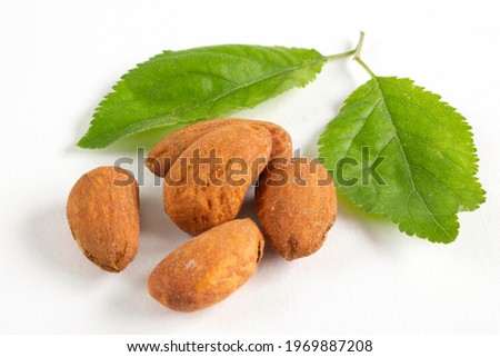 A pile of Almonds, isolated on a white background.