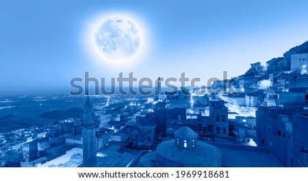 Mardin old town, spectacular Mesopotamia in the background with full blue moon - Mardin, Turkey "Elements of this image furnished by NASA"