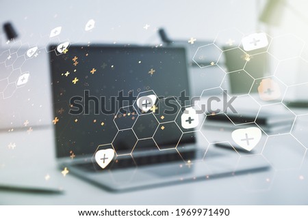 Creative abstract medical hologram on modern computer background, online medical consulting concept. Multiexposure