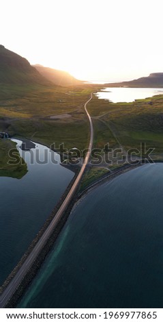 The road along the lake in the morning drone shot