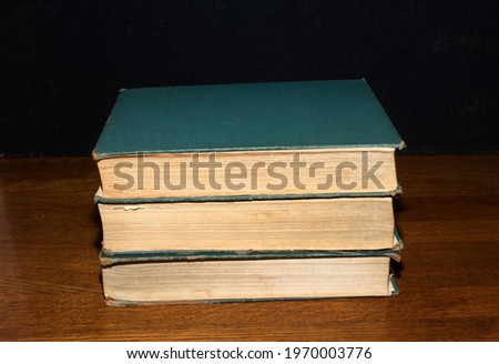 a pile of books placed on the table