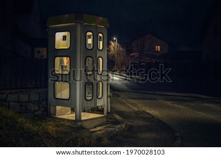 night telephone booth. mystical and mysterious street phone. dangerous place on an empty street