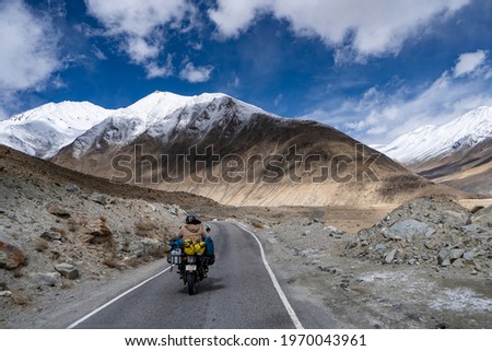 Motorcycle travelers ride in indian Himalaya roads,leh ladakh . Royalty-Free Stock Photo #1970043961