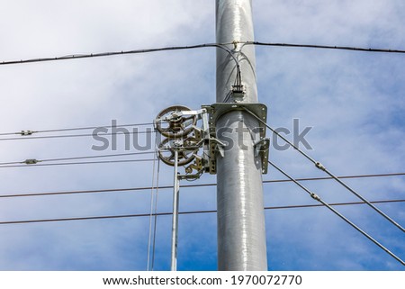 Gear on a high voltage pylon