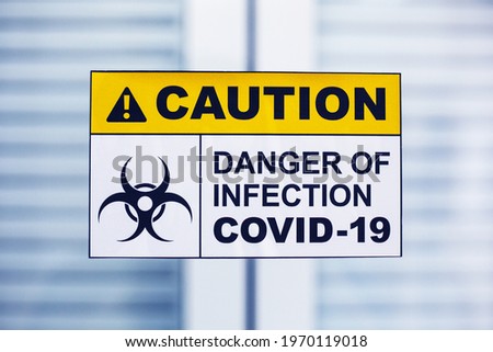 Warning sign of covid 19 in lab. Coronavirus pandemic.