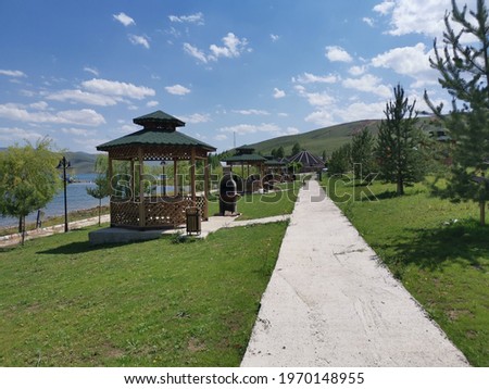 Very beautiful landscape at the lake with a calming view to relax with summery green botany