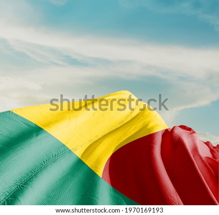 Benin waving flag in the sky.