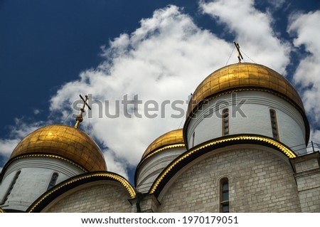 Golden domes of the Assumption Cathedral. This Russian Orthodox church dedicated to the Dormition of the Theotokos was originally the personal chapel for the Muscovite tsars. Royalty-Free Stock Photo #1970179051