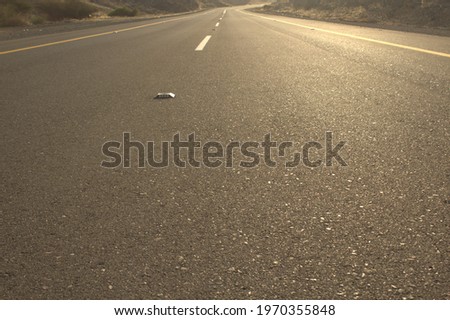 two lane road across rocky desert