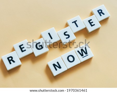 Text register now made from square letter tiles with black font on orange background.