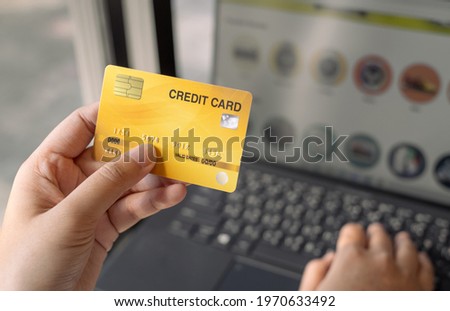 woman holding credit card and use laptop for with shopping online. Online payment concept.