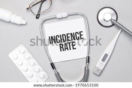 In the notebook is the text incidence rate, stethoscope, pills, and glasses.